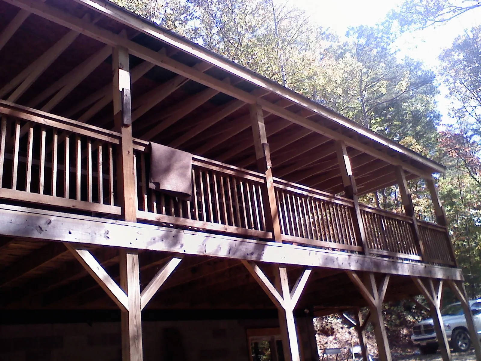 Timber framing under a new elevated porch and deck — Roof Leak Repair in Olmstead by Roofing Brothers